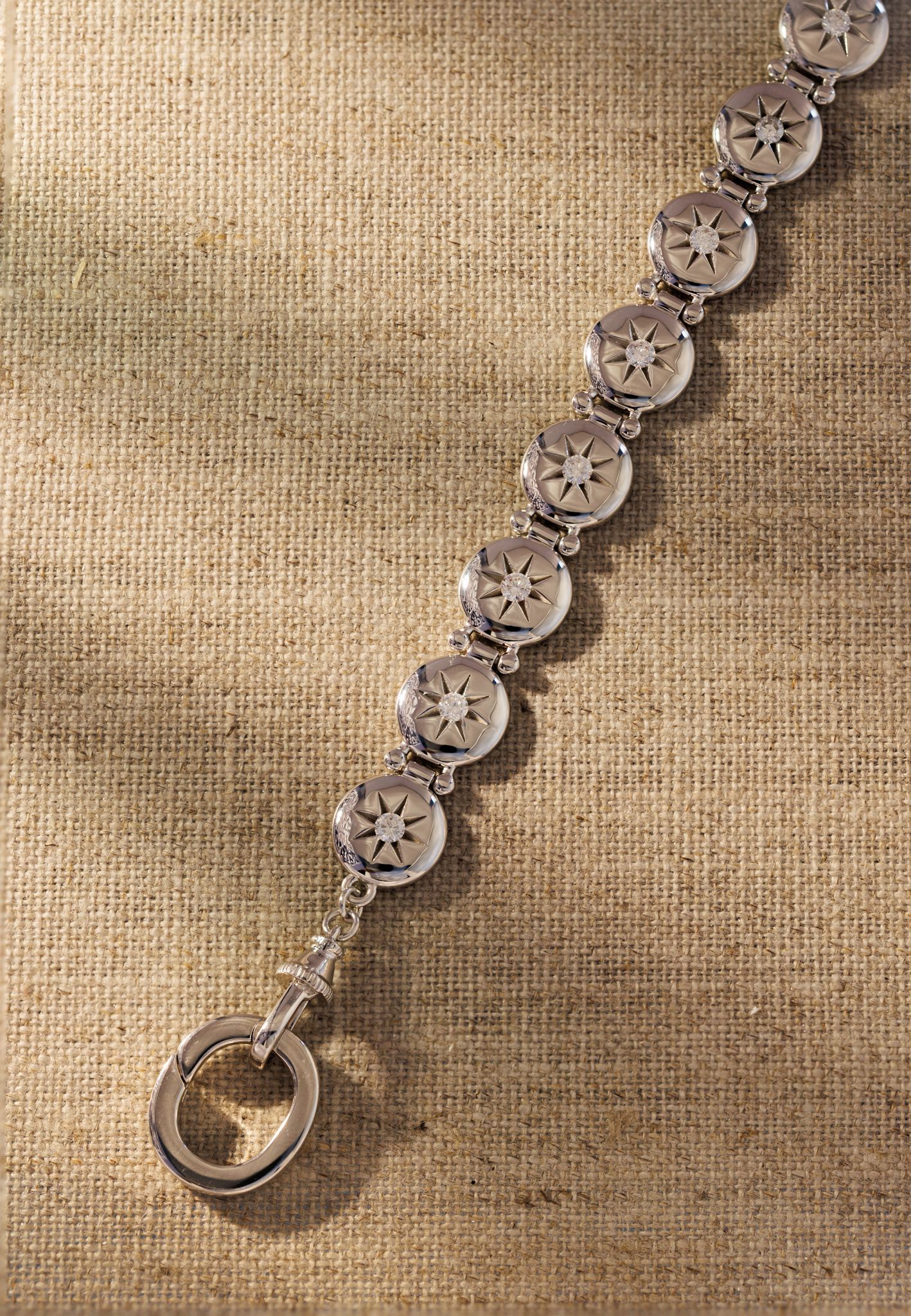 Raven James Alba Bracelet in 925 sterling silver - vintage button-inspired disc bracelet with star-set cubic zirconia and signature oval clasp