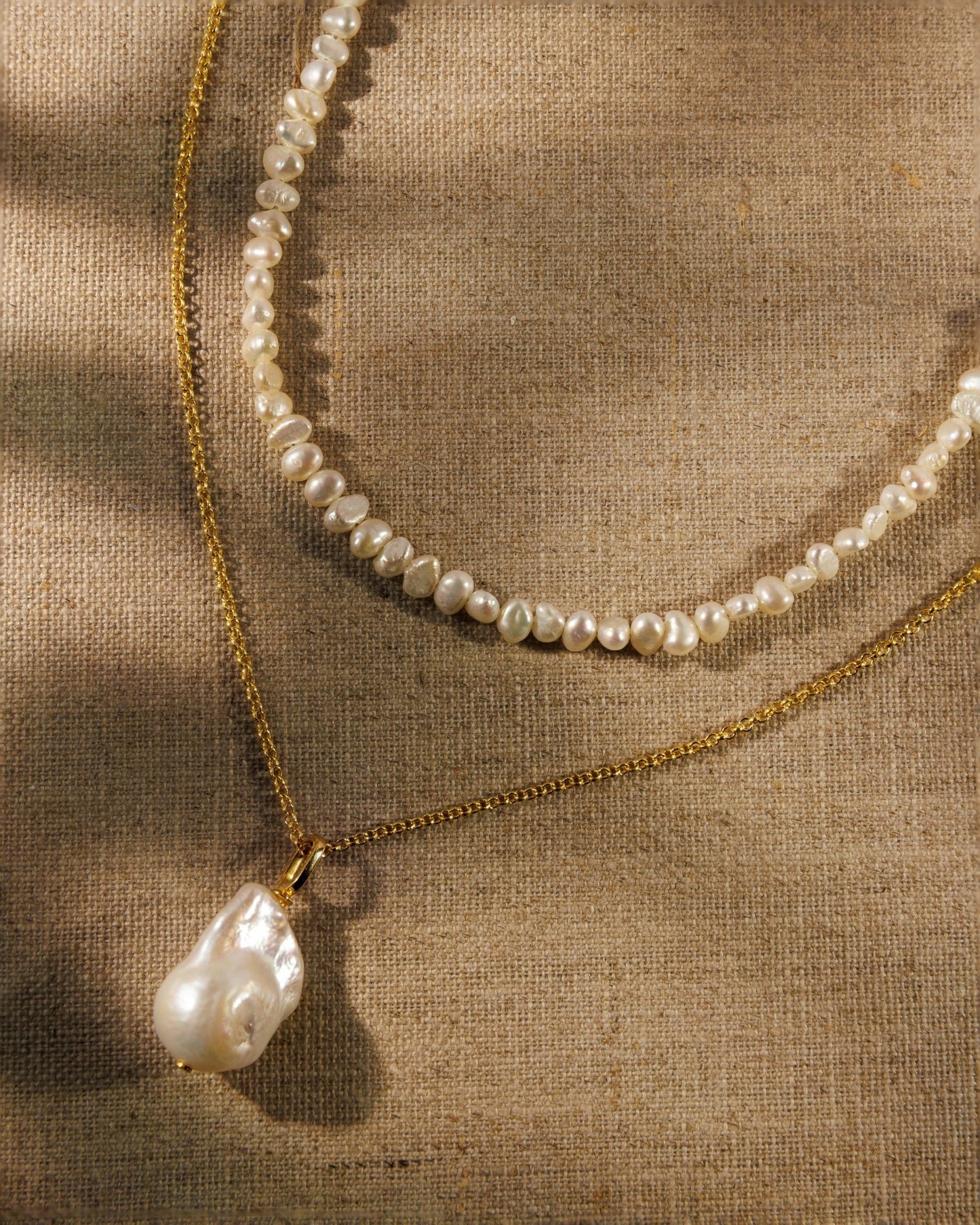  baroque pearl necklace, fine gold chain and pearl pendant. Antique-inspired demi-fine jewellery designed to layer, connect and restyle.