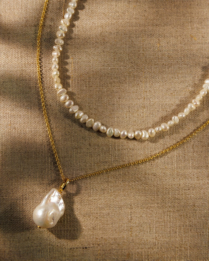  baroque pearl necklace, fine gold chain and pearl pendant. Antique-inspired demi-fine jewellery designed to layer, connect and restyle.