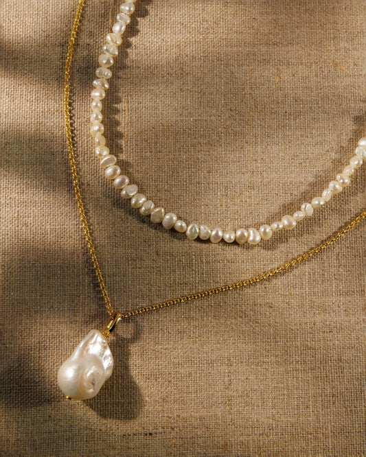  baroque pearl necklace, fine gold chain and pearl pendant. Antique-inspired demi-fine jewellery designed to layer, connect and restyle.