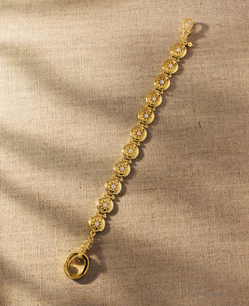 Raven James Alba Bracelet in 18ct gold plated brass - vintage button-inspired disc bracelet with star-set cubic zirconia and signature oval clasp