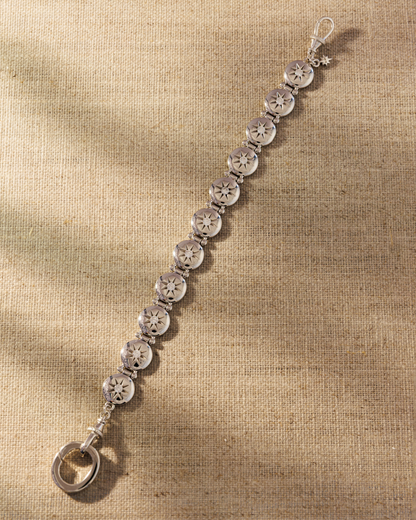 Raven James Alba Bracelet in 925 sterling silver - vintage button-inspired disc bracelet with star-set cubic zirconia and signature oval clasp