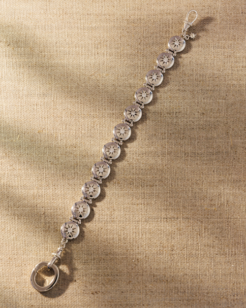 Raven James Alba Bracelet in 925 sterling silver - vintage button-inspired disc bracelet with star-set cubic zirconia and signature oval clasp