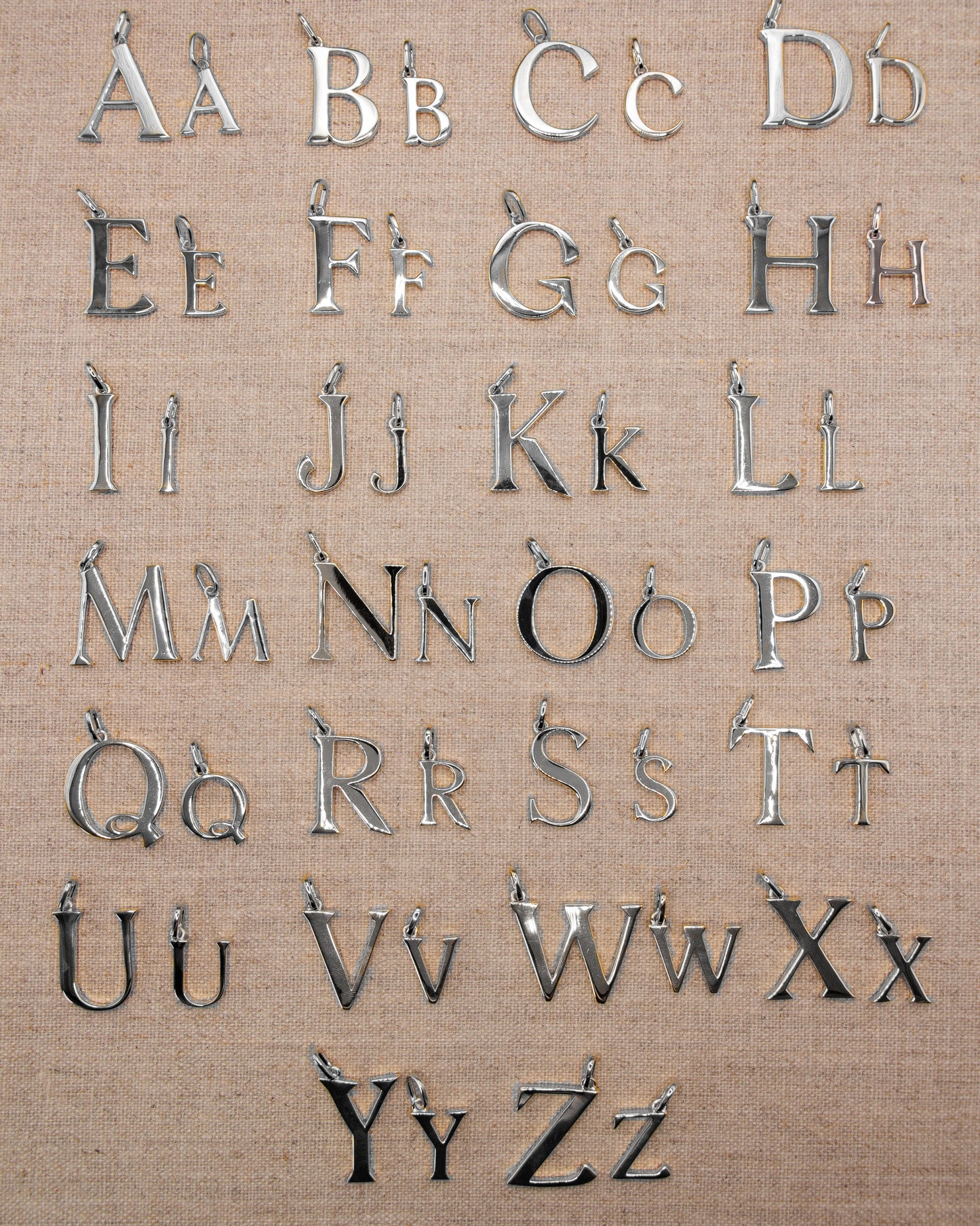 Solid silver alphabet initial pendants