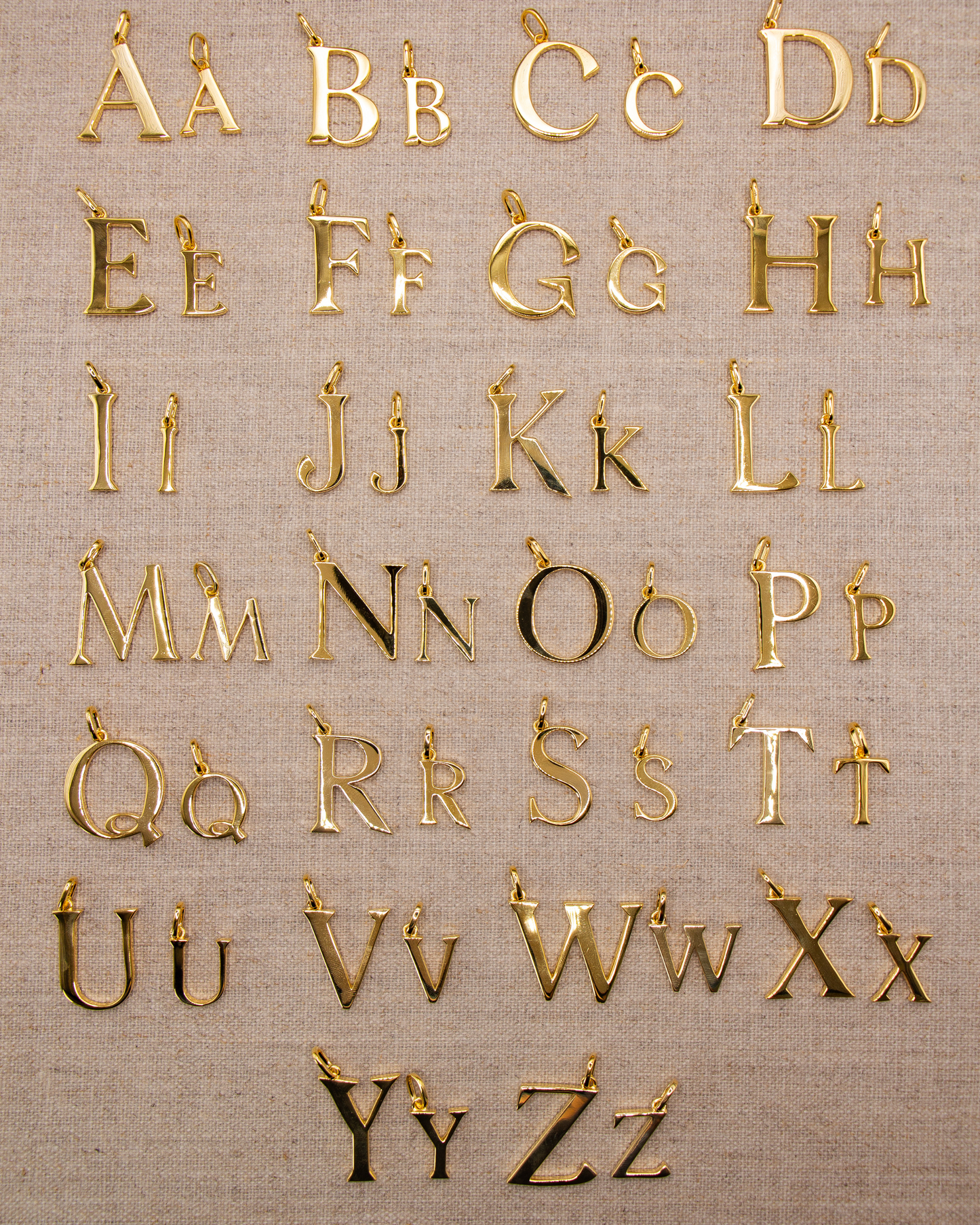 Small gold alphabet pendant initial charm in recycled sterling silver with 18ct gold plate