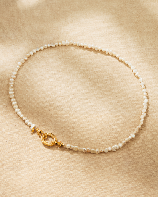 Aura baroque pearl necklace with gold clasp and oval ring, designed for multiway styling and adding pendants
