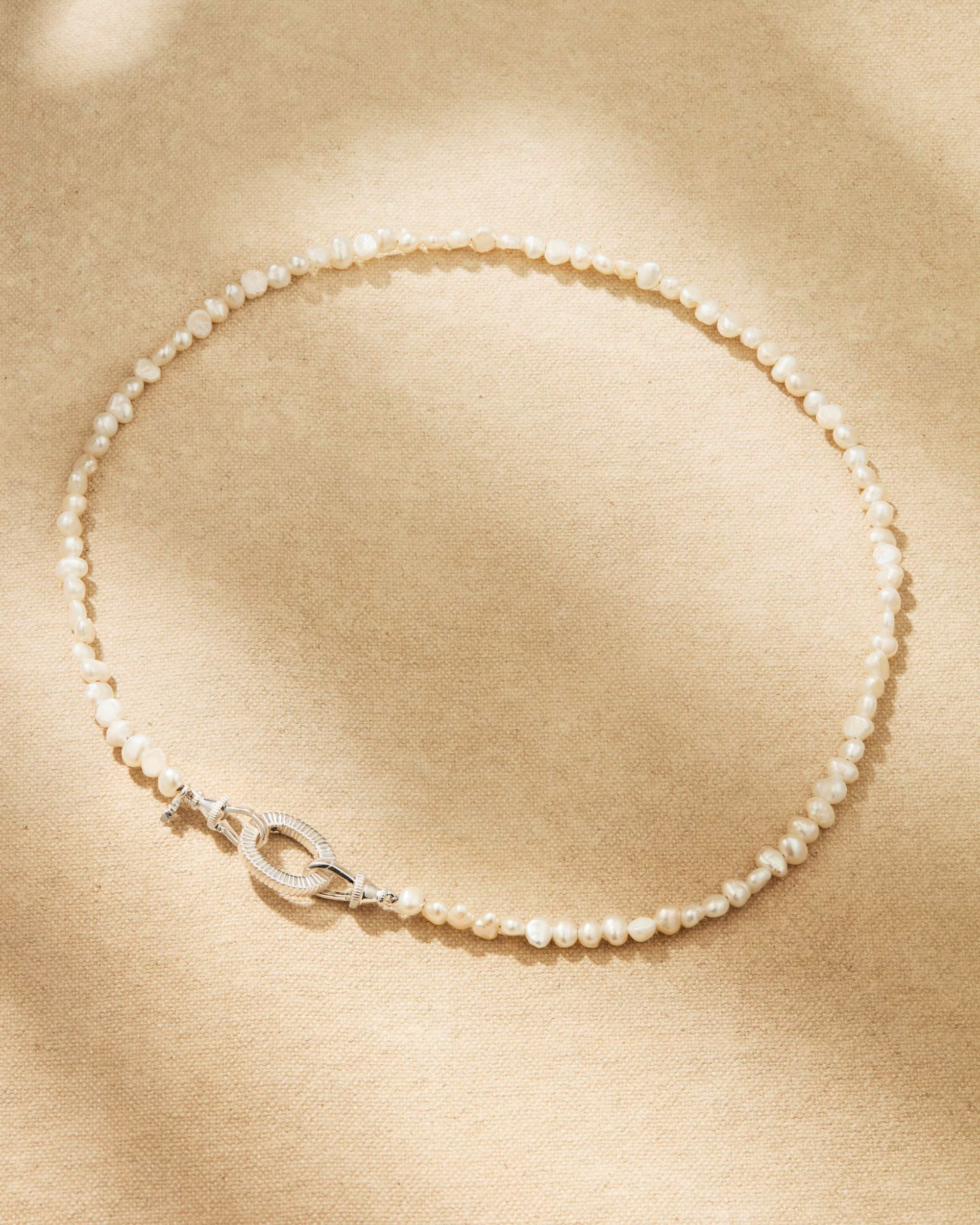 Aura baroque pearl necklace with sterling silver clasp and oval ring, designed for multiway styling and adding pendants