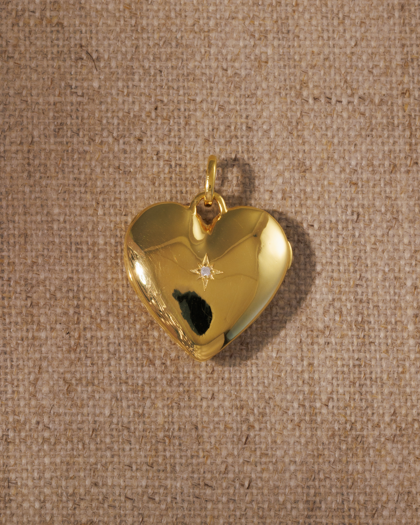 Cora gold heart locket pendant with vintage inspired starburst crystal detailing