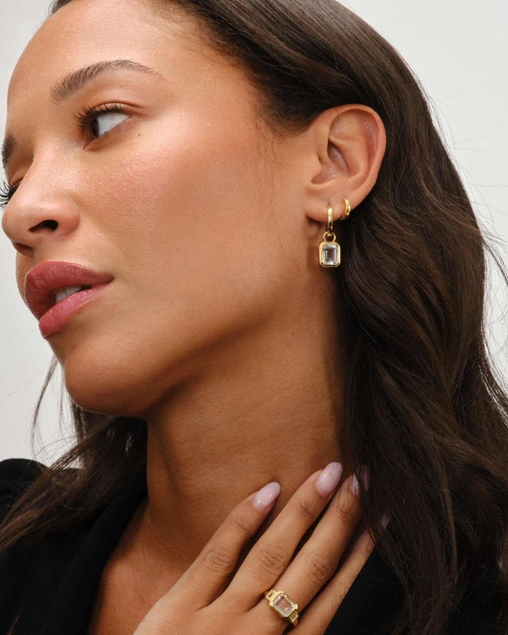 Clear Quartz Emerald Cut Ring and earrings worn by model 