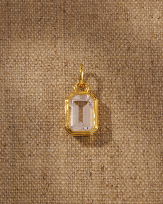 Emerald cut clear quartz pendant in gold bezel setting