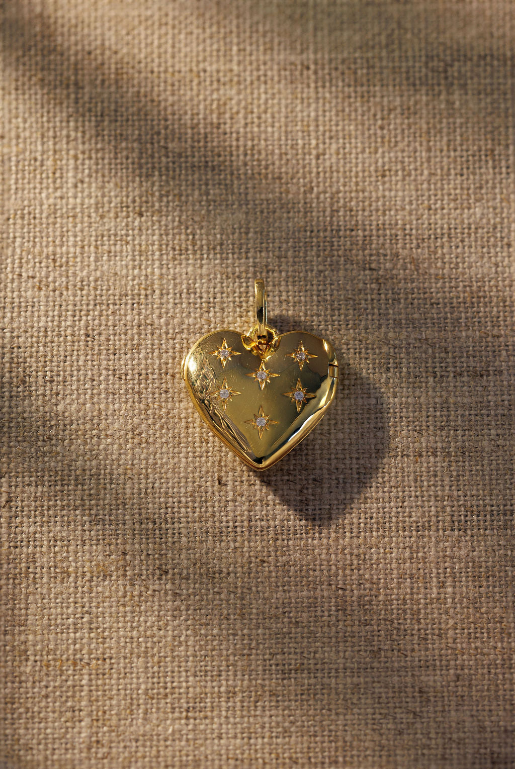 Raven James Cora Pendant 18ct gold plated heart locket with star-set crystals 