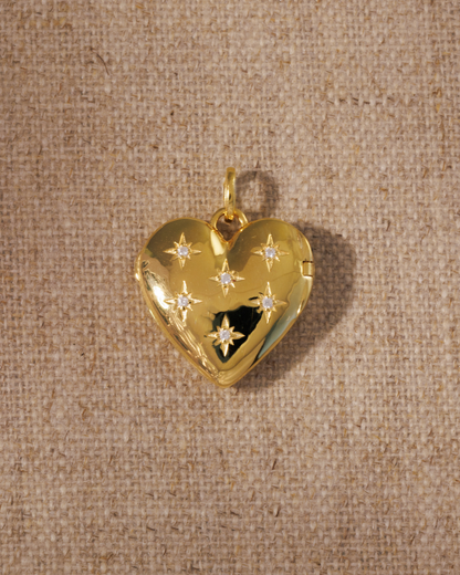 Cora gold heart locket pendant with vintage inspired starburst crystal detailing