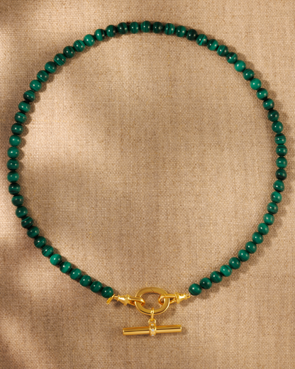 Malachite bead necklace with gold T-bar pendant on antique inspired clasp