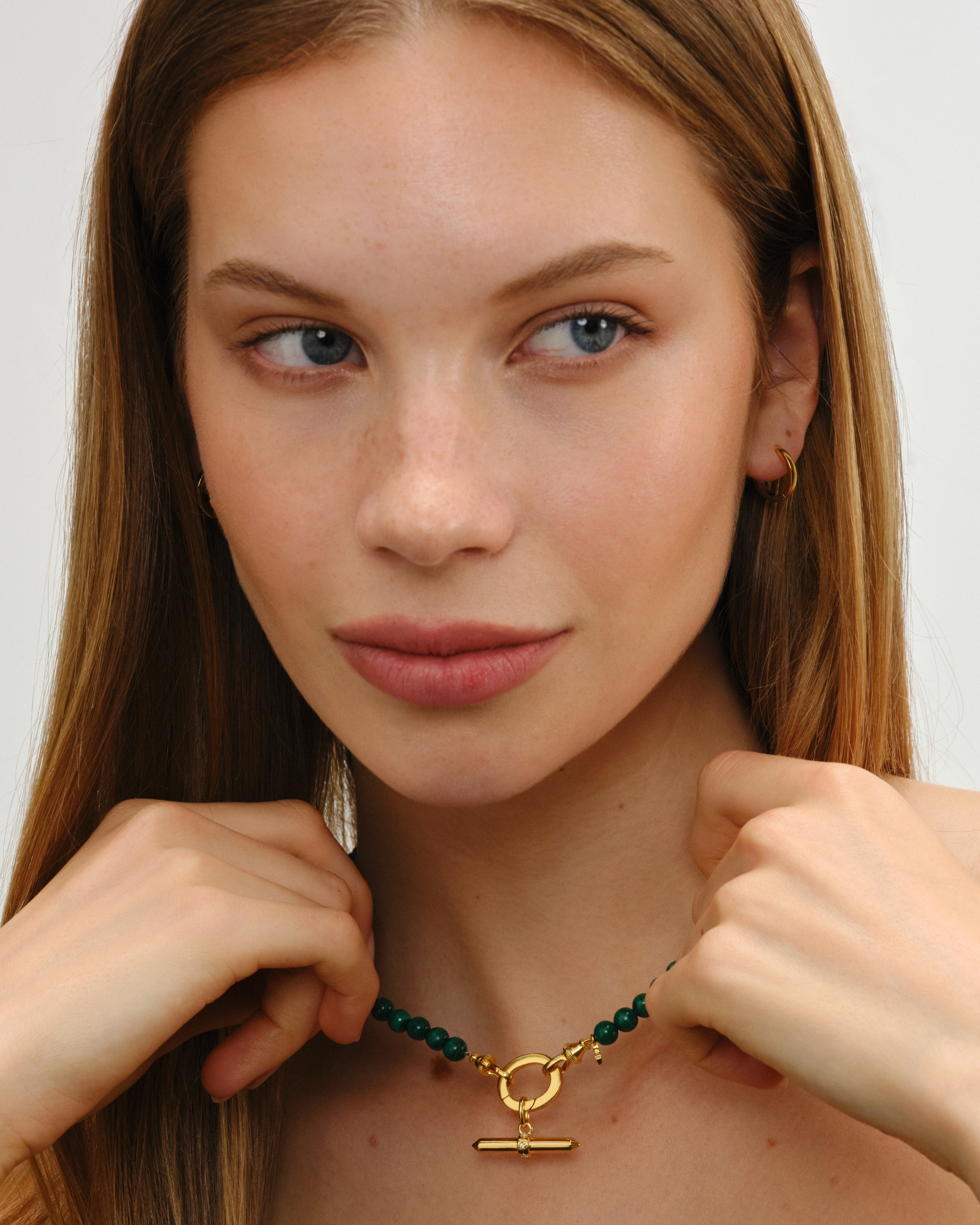 Fearne malachite beaded necklace styled with Lucy gold T-bar pendant