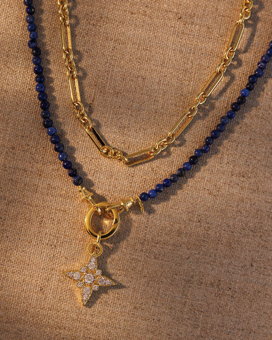 Layered gold necklace set with lapis beaded necklace and crystal star pendant