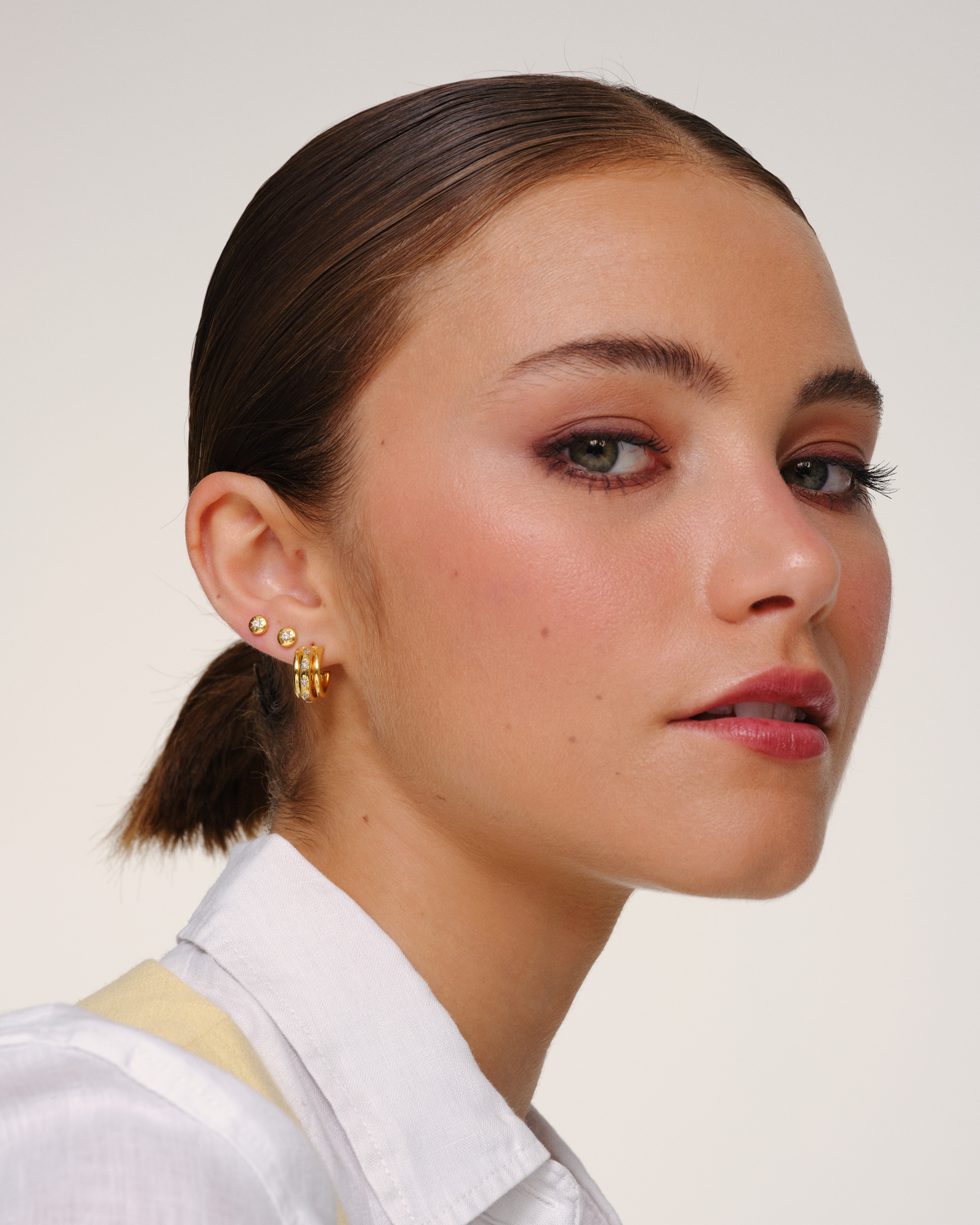 Gold hoop earrings with crystal star detailing and removable jacket, convertible multiway earrings