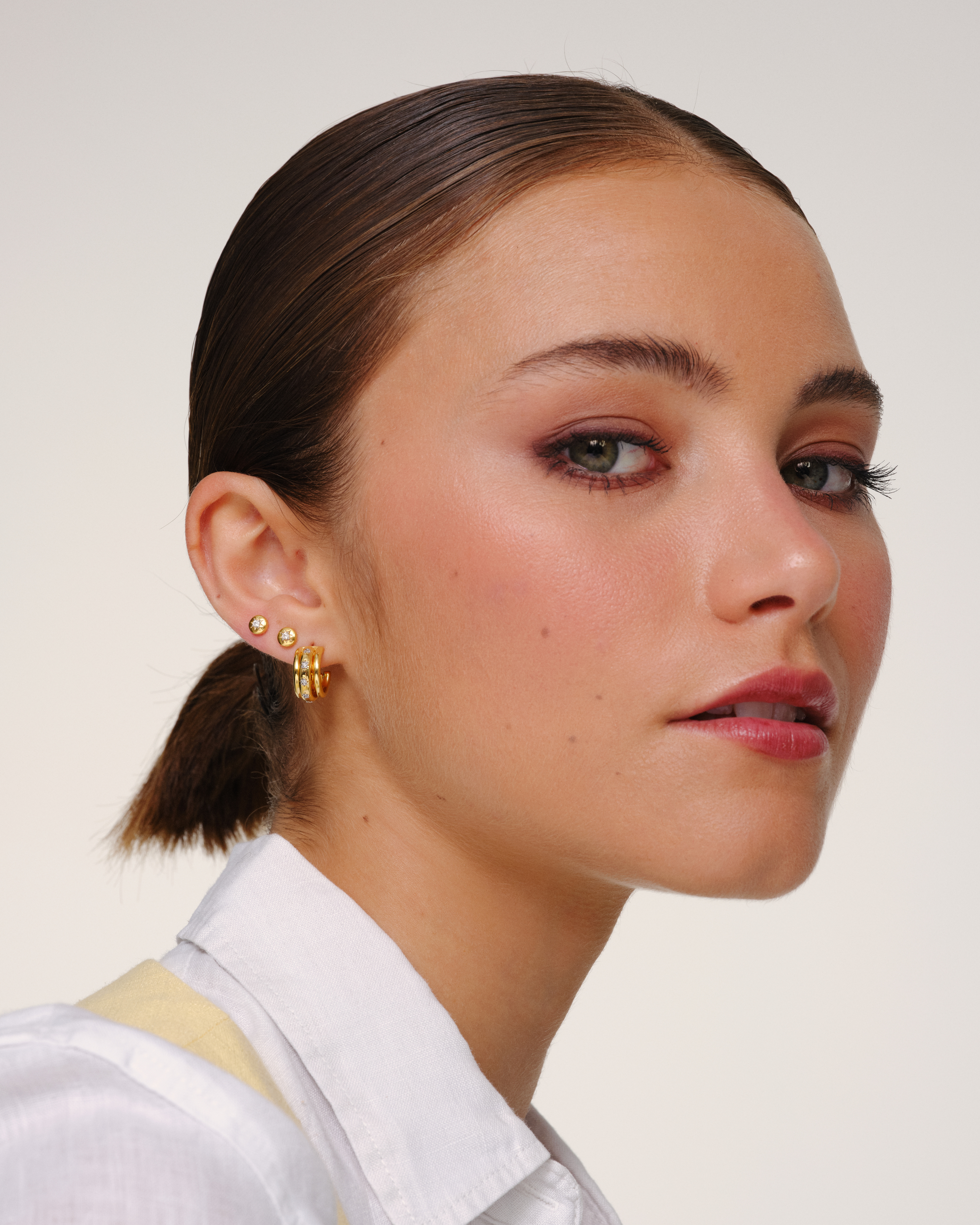 Gold hoop earrings with crystal star detailing and removable jacket, convertible multiway earrings