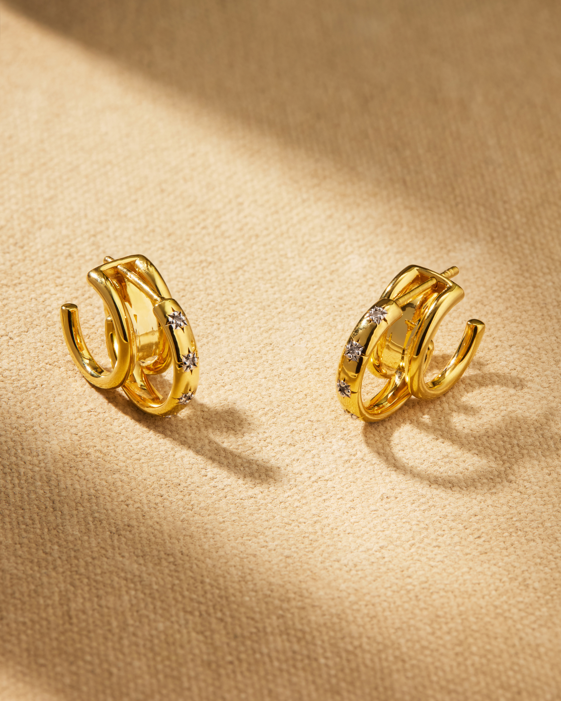 Jemima gold hoop earrings with engraved star design and detachable jacket for multiple styling options