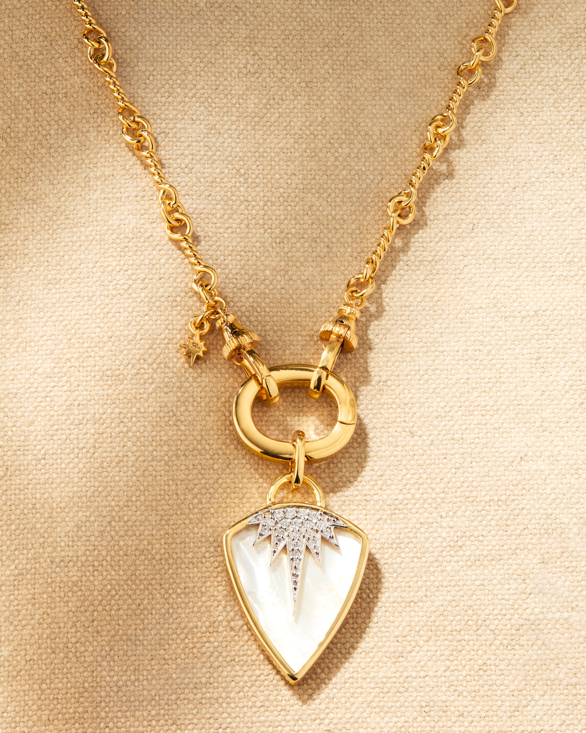 Gold multiway necklace with mother of pearl pendant, gold planted chain with oval ring clasp and interchangeable pendant styling
