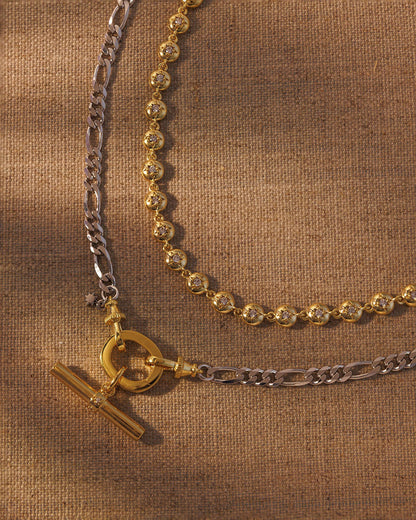 Layered gold and silver necklace set with T-bar pendant and crystal link chain