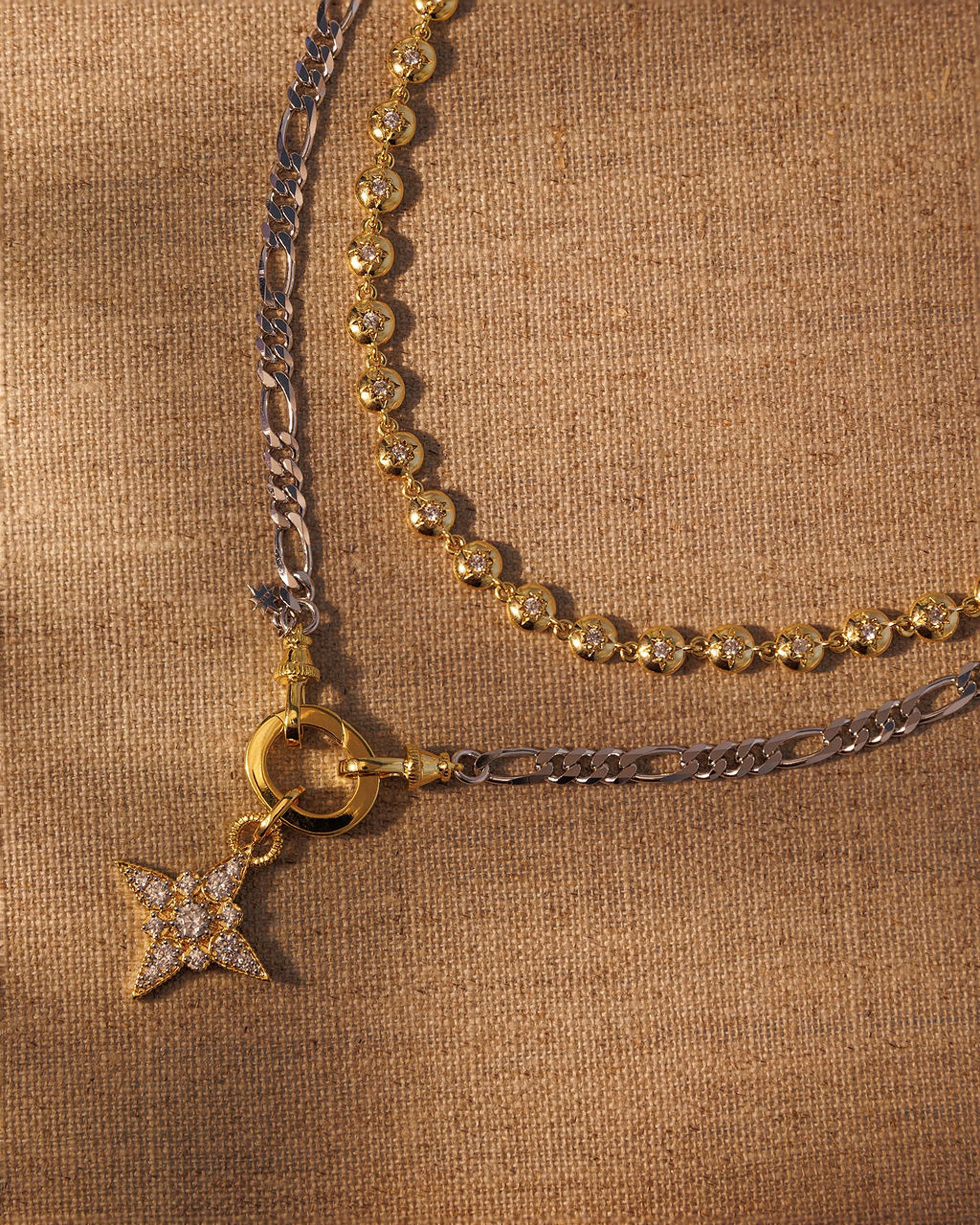 Layered gold and silver necklace set with crystal star pendant