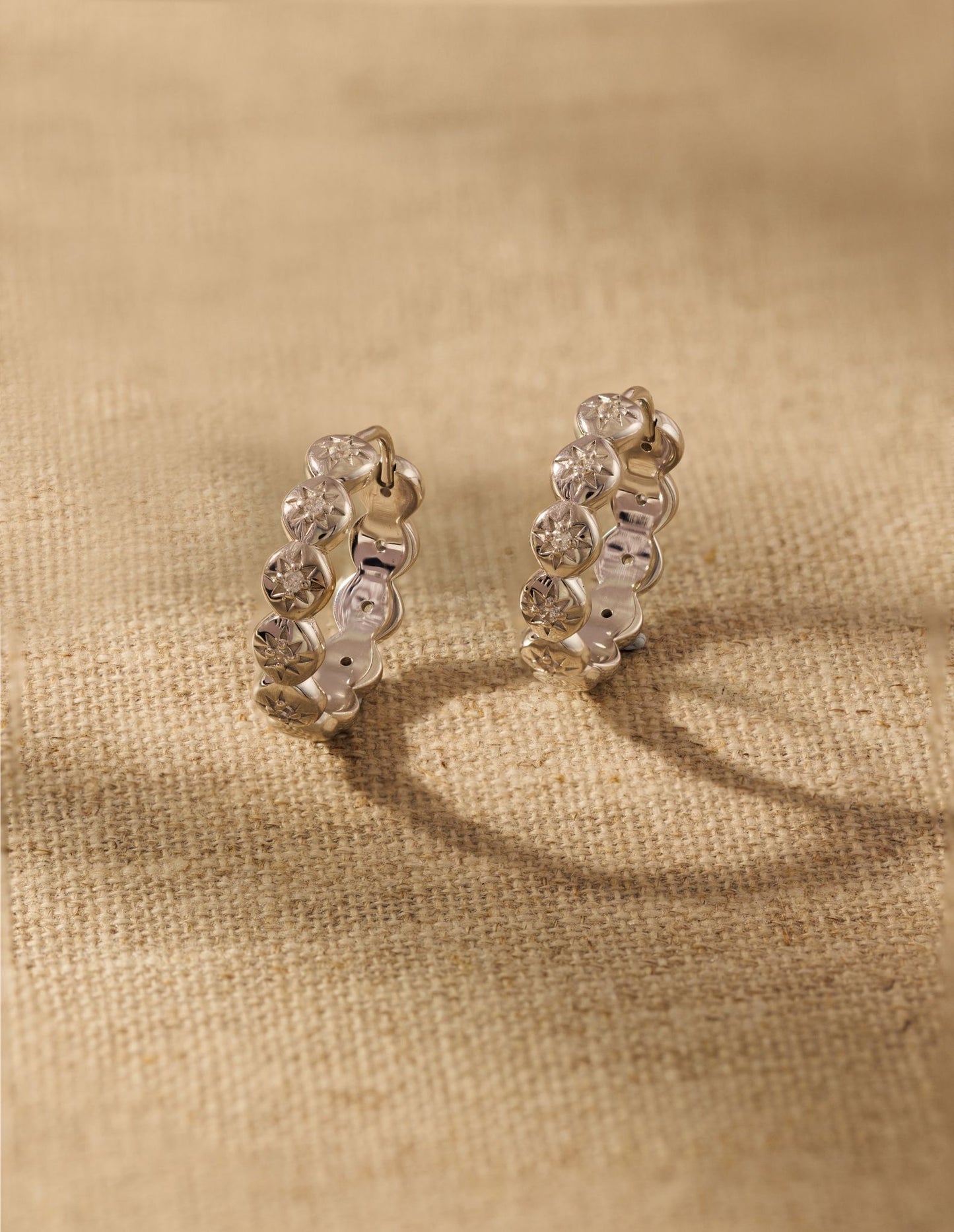 Raven James Layla Hoop Earrings in solid 925 silver - vintage-inspired midi hoops with star-set cubic zirconia and hinge fastening.