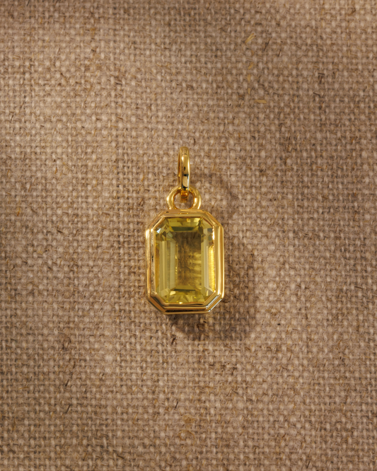 Gold pendant with emerald cut lemon quartz gemstone