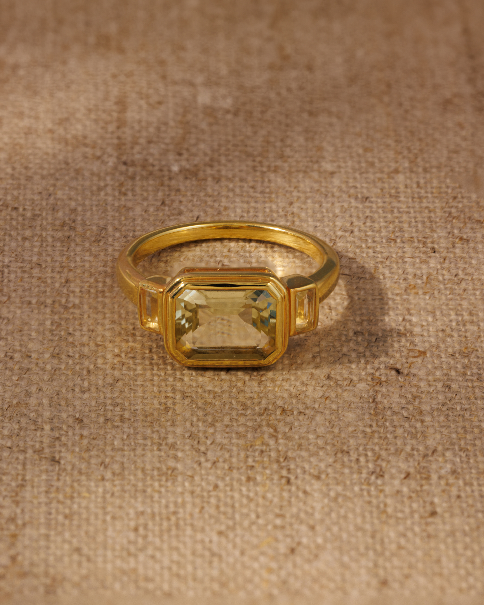 Lemon quartz emerald cut ring in gold vermeil bezel setting with baguette side stones