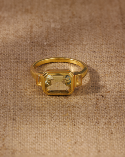 Lemon quartz emerald cut ring in gold vermeil bezel setting with baguette side stones