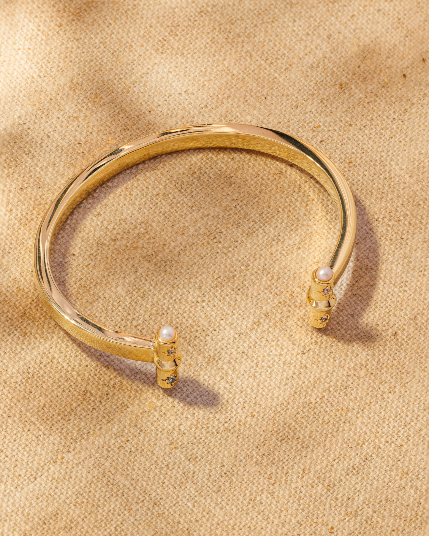 Gold open cuff bracelet with T-bar ends, crystals and pearl detail