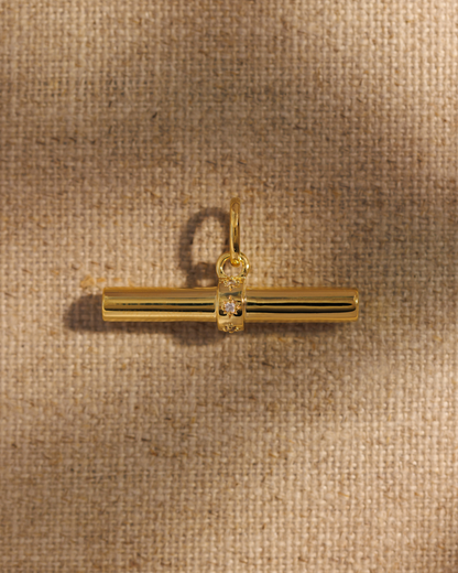 Gold T-bar pendant charm with crystal detail can be attached to chain necklace with oval clasp 