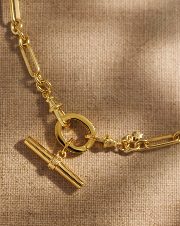 Lucy gold T-bar pendant with crystal stars on Tabitha paperclip chain necklace