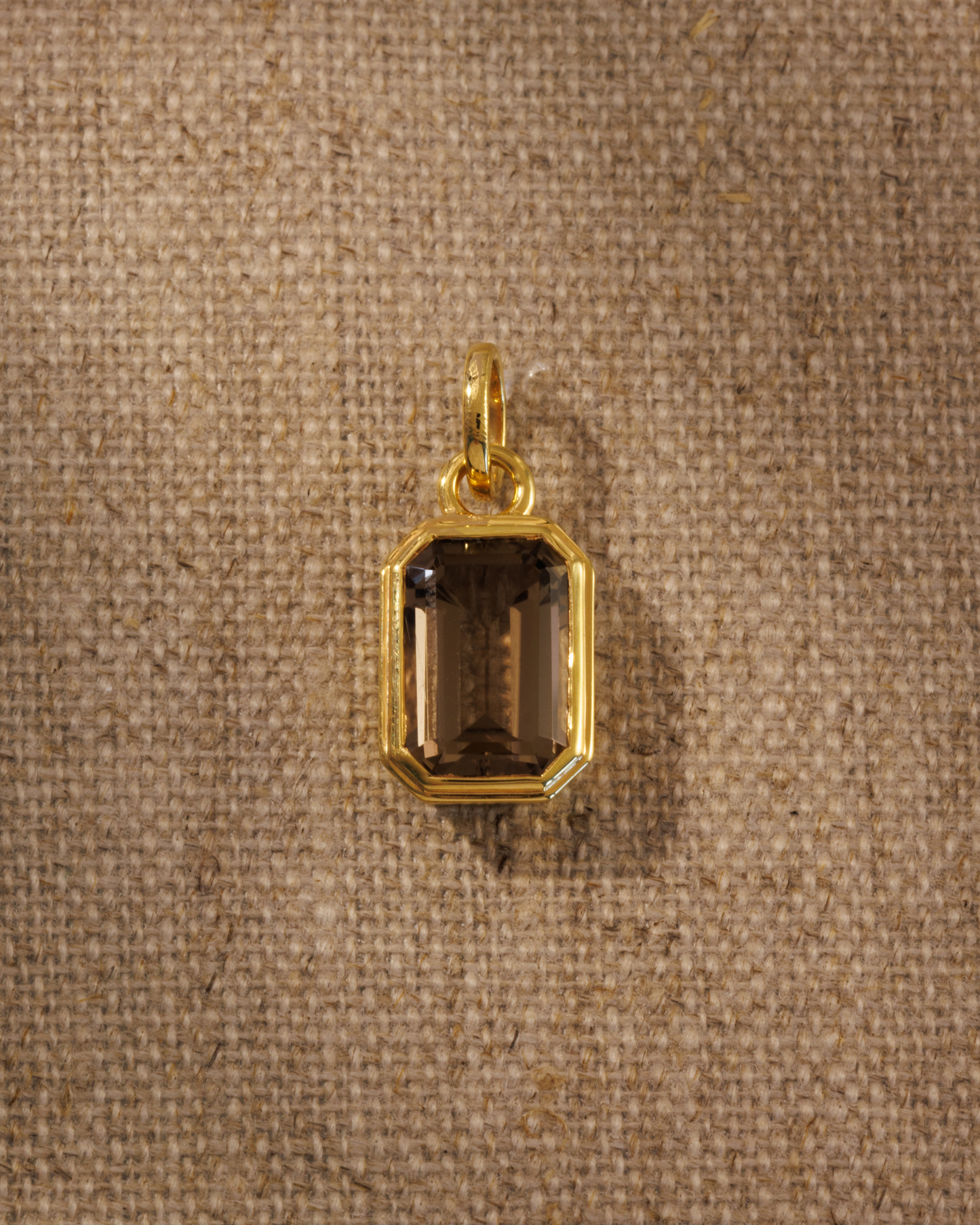 Lumi emerald cut smoky quartz pendant in gold bezel setting