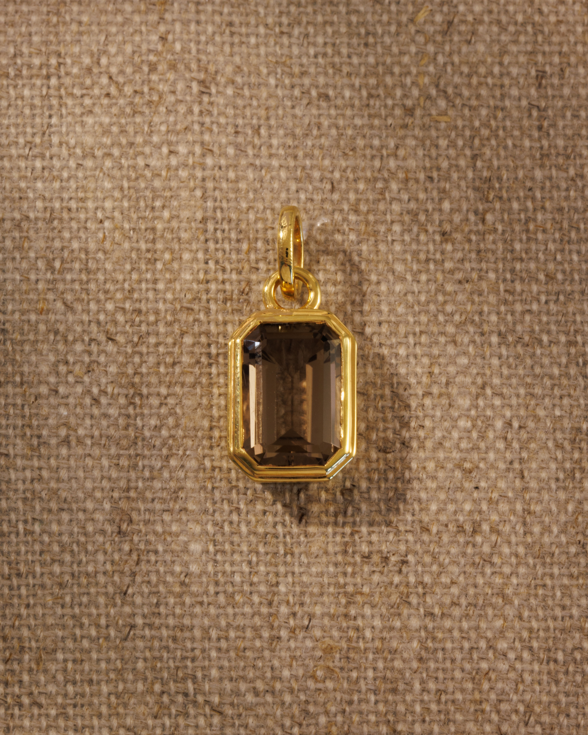 Lumi emerald cut smoky quartz pendant in gold bezel setting