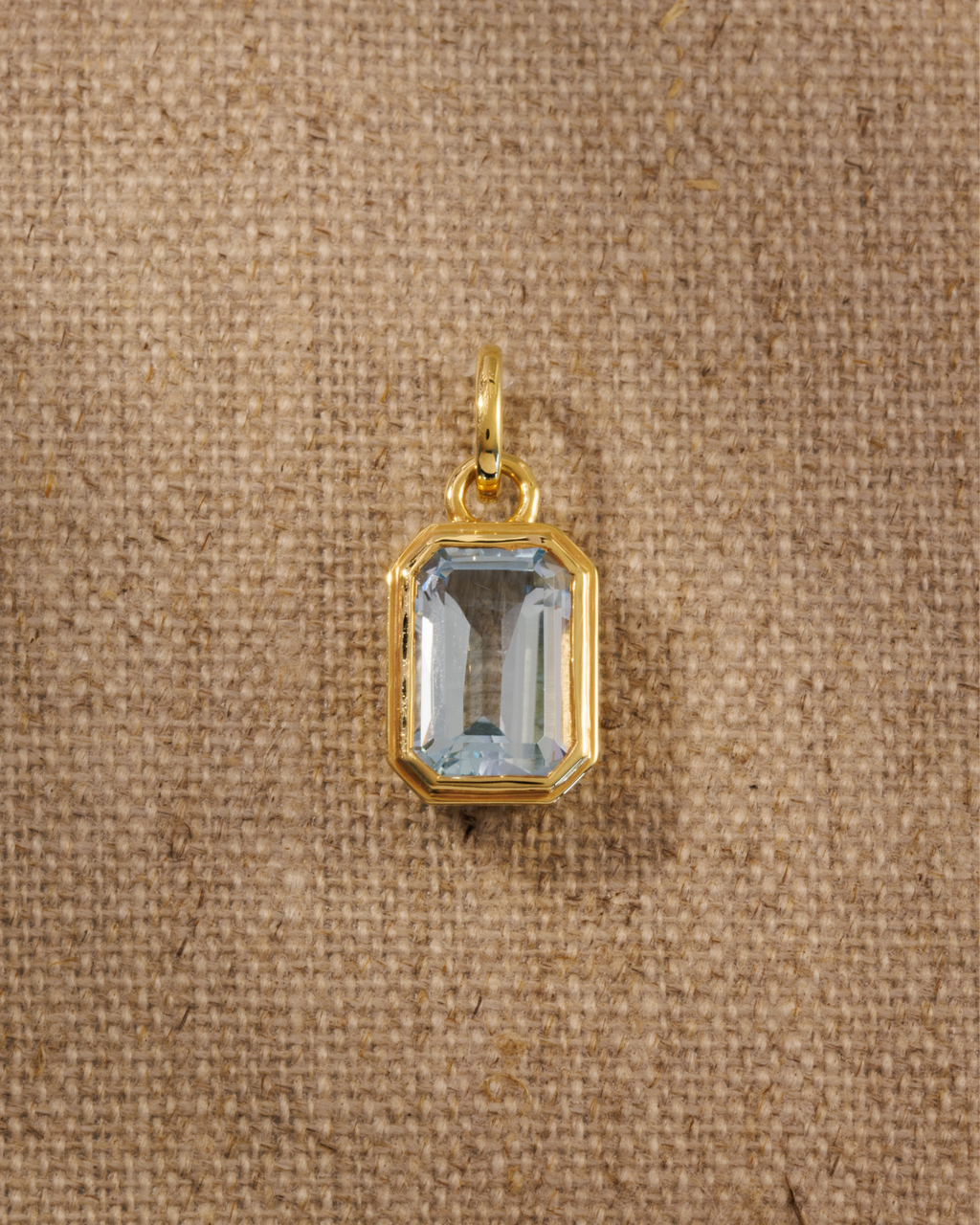Lumi 18ct gold plated emerald cut blue topaz pendant
