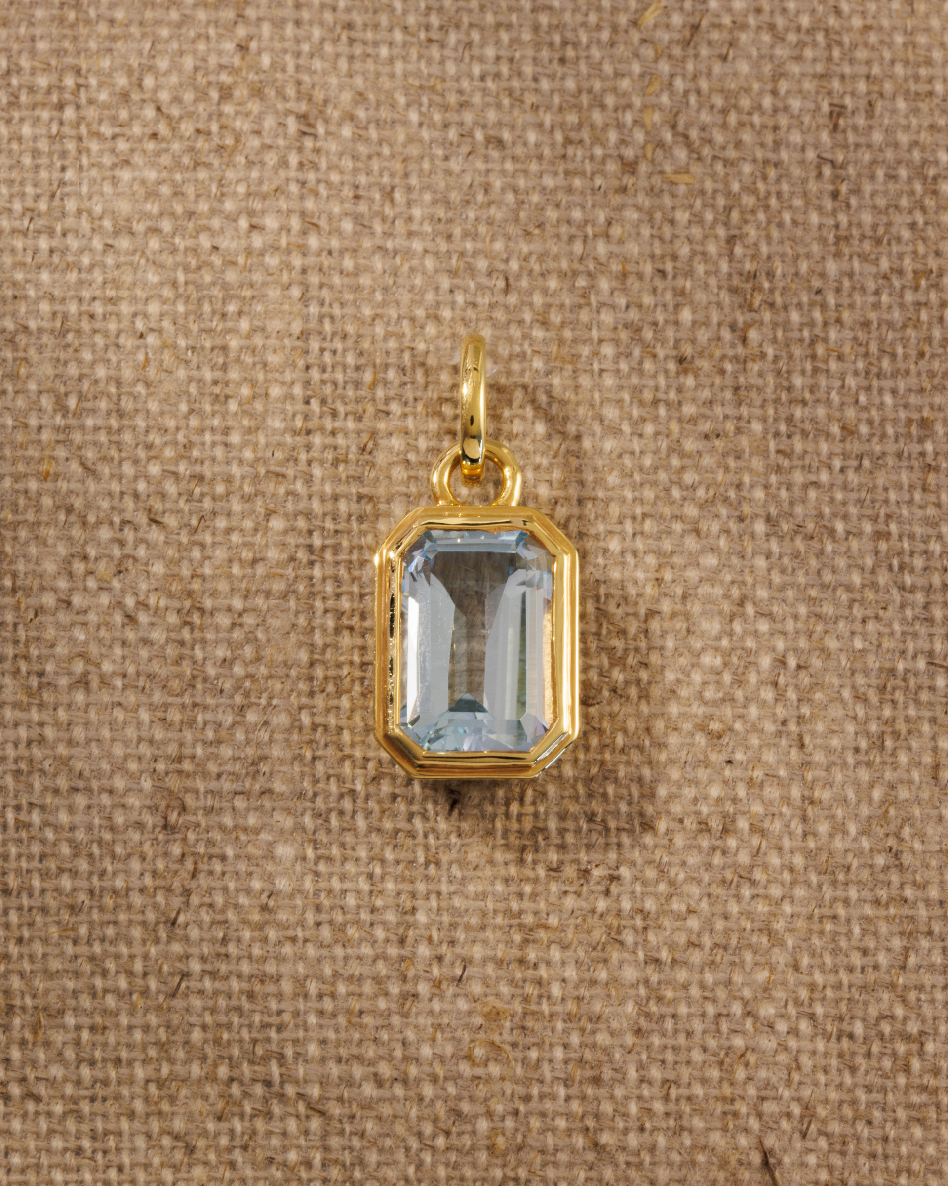 Lumi 18ct gold plated emerald cut blue topaz pendant