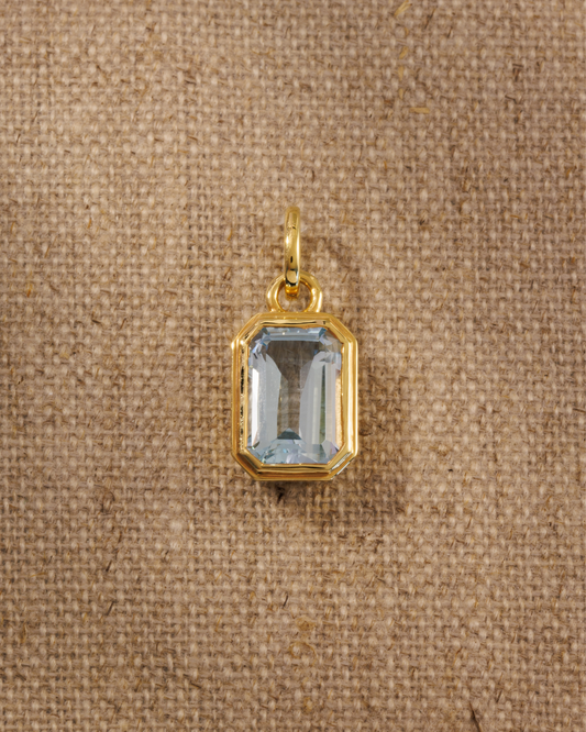 Lumi 18ct gold plated emerald cut blue topaz pendant