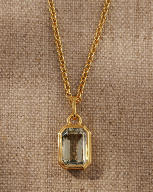 Lumi 18ct gold plated emerald cut green amethyst pendant styled on a gold chain necklace