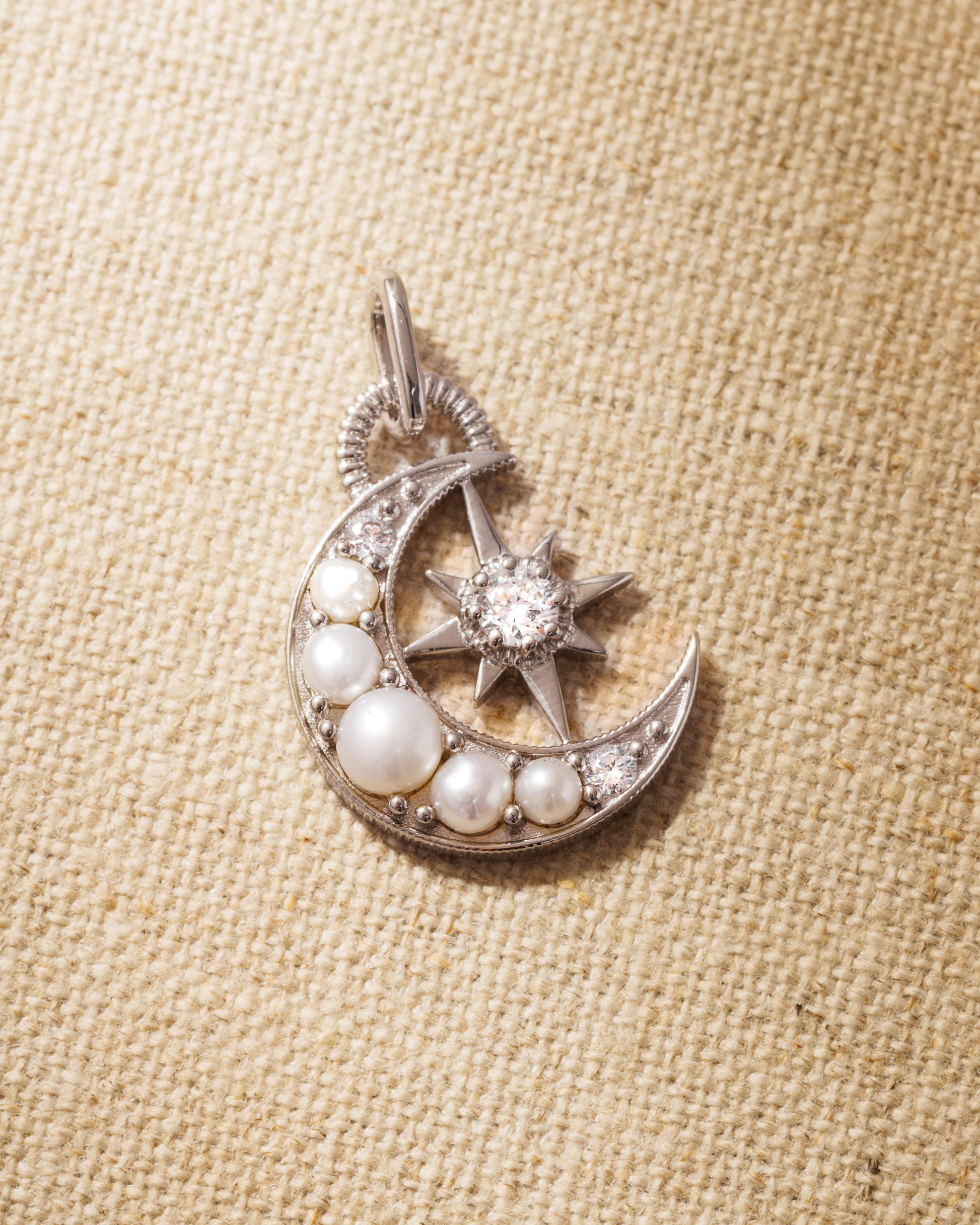 Silver moon pendant with pearls and brilliant cut crystals 