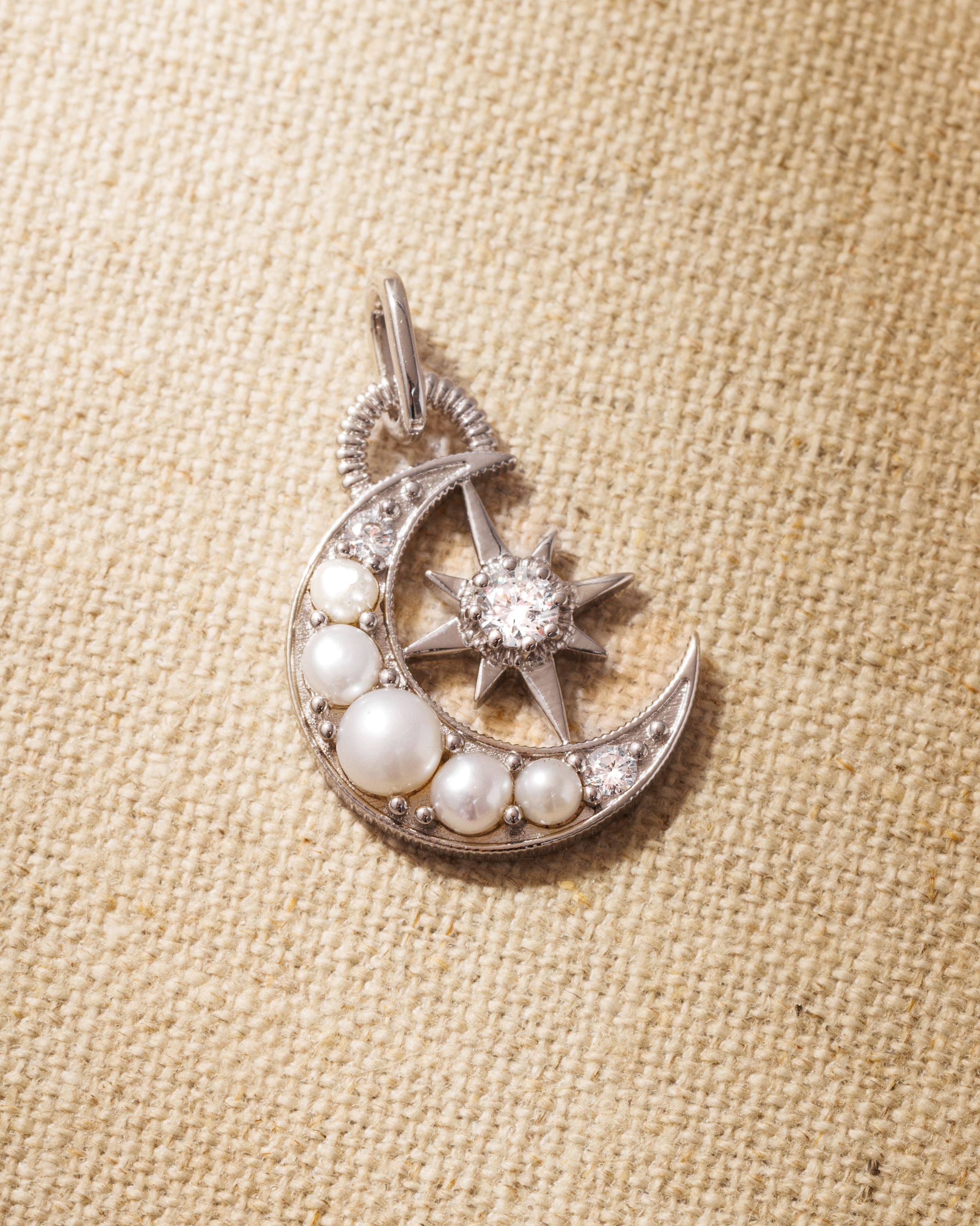 Silver moon pendant with pearls and brilliant cut crystals 