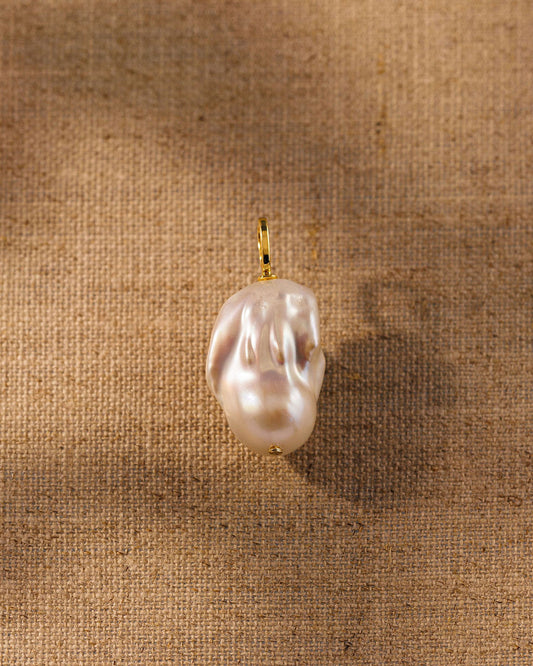 A single freshwater baroque pearl pendant, unique in shape and finish. Antique-inspired demi-fine jewellery, designed to pair with any of our chains.
