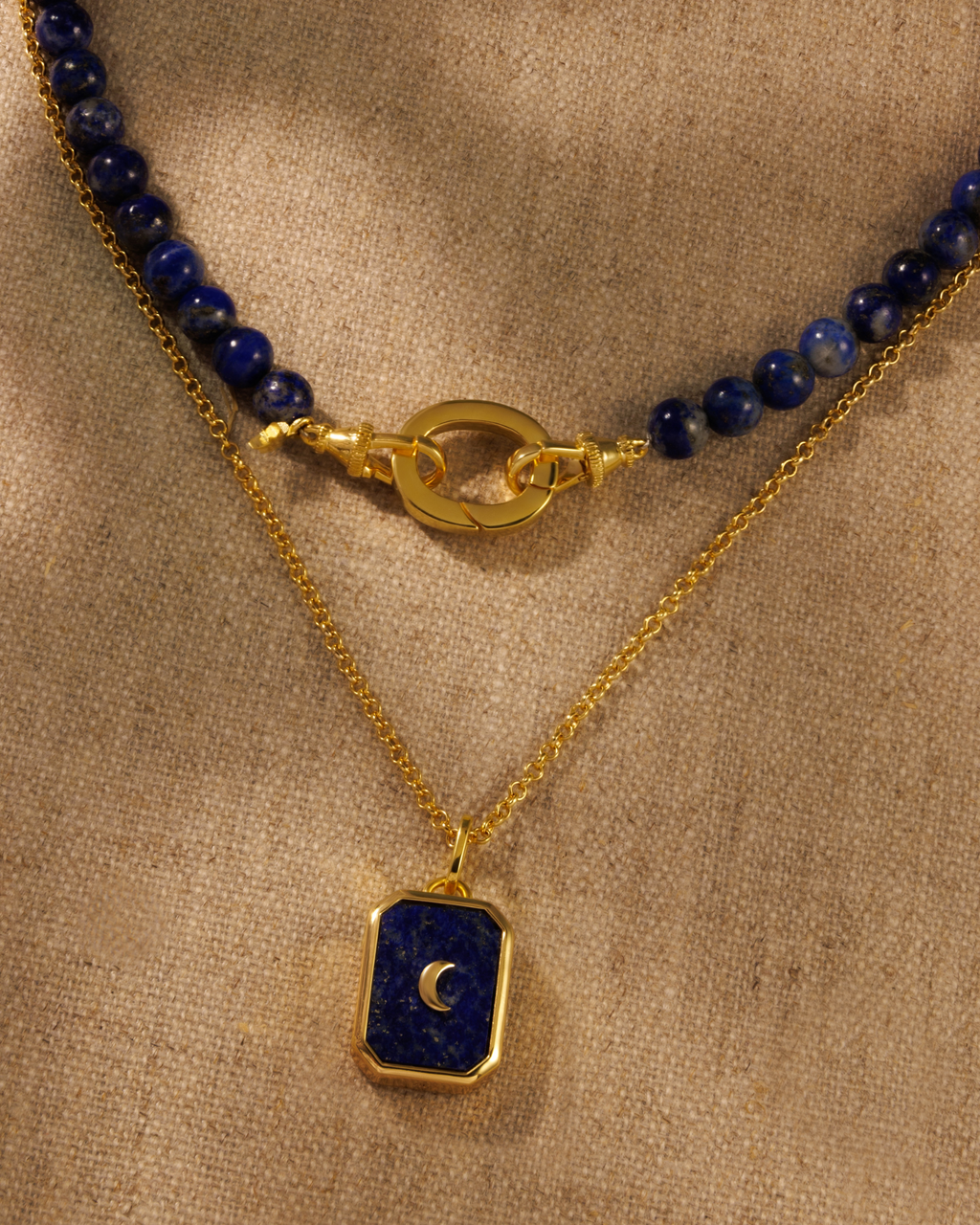 Moon talisman lapis lazuli pendant on Ivy gold chain layered with Indigo lapis beaded necklace