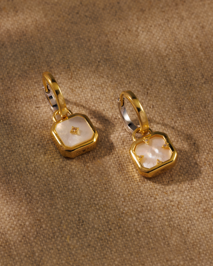 Pearl moon talisman earring charms on Cara hoops