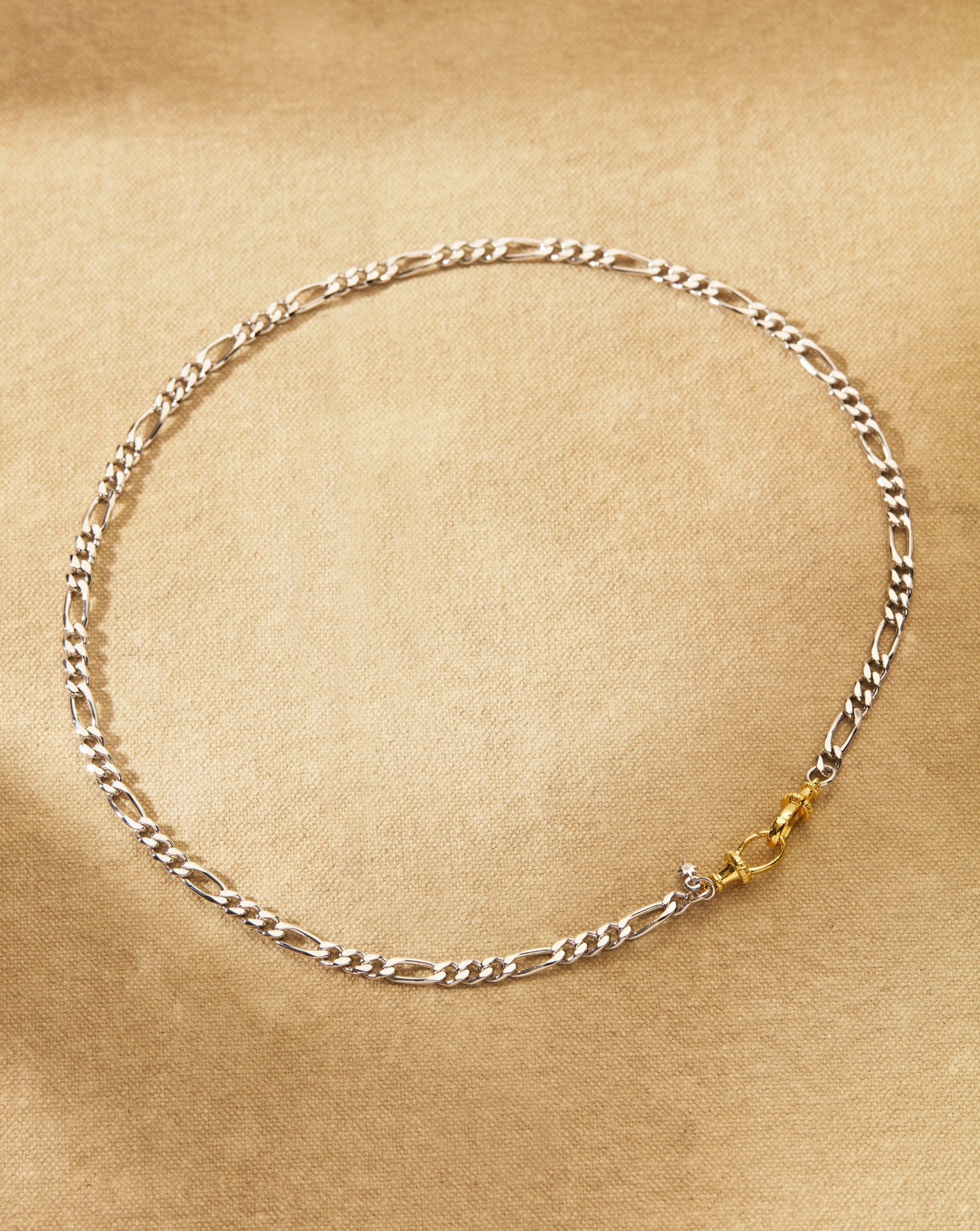 Figaro chain necklace with oval clasp and lobster fastening in mixed metals silver and gold