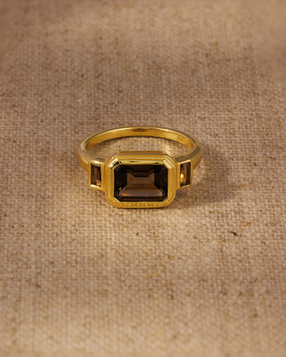 Smoky quartz emerald cut ring in gold vermeil bezel setting with baguette side stones