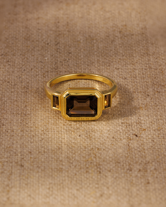 Smoky quartz emerald cut ring in gold vermeil bezel setting with baguette side stones