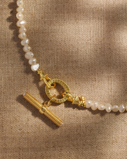 Libby gold T-bar pendant with pearl detail on Aura baroque pearl necklace
