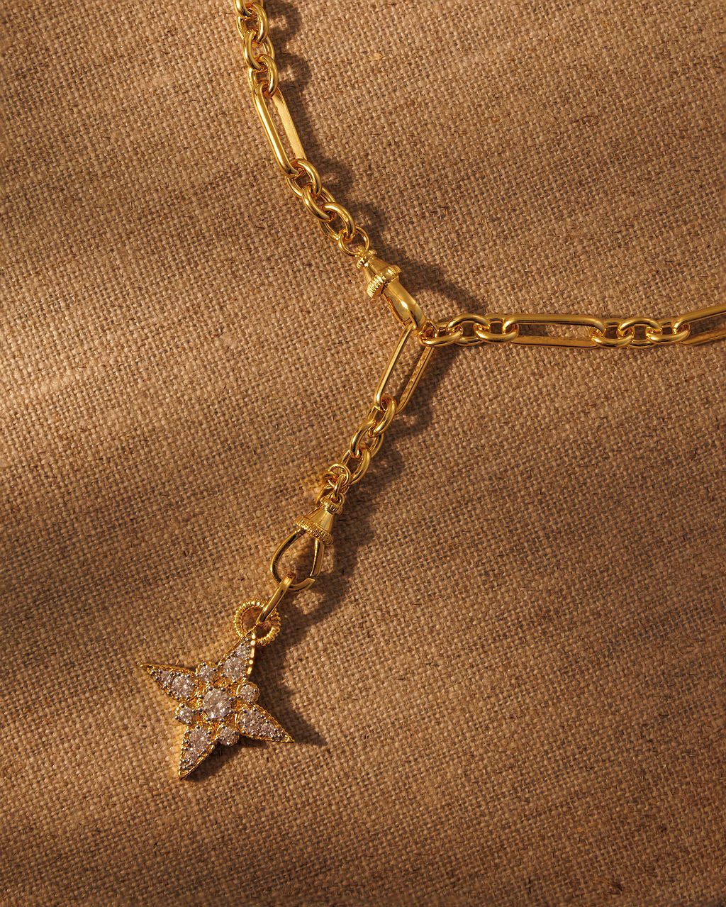 gold paperclip chain necklace with star crystal pendant and multiway clasp detail