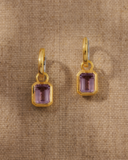 Cara reversible huggie hoop earrings styled with Lumi emerald cut pink amethyst charm in 18ct gold