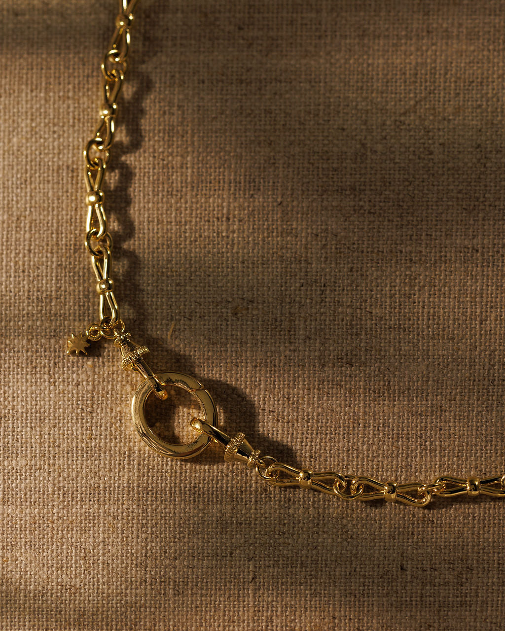 EADIE gold bow tie chain with signature triple clasp